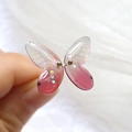 Macro view of gradient resin butterfly wings with glitter and golden metal accents - Gradient Pink Butterfly