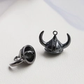 Close-up of gunmetal bull horn helmet pendant with detailed texture for DIY jewelry - Bull King Hat / Gunmetal
