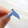 Macro shot of gradient blue and purple resin fish tail pendant with fine glitter detail - Starry Sky Fish Tail