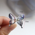 Detail of a purple gradient butterfly wing charm with glitter inlay and 20mm size scale - Black Pattern Butterfly