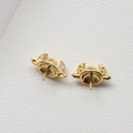 Macro shot of gold plated copper devil horn jewelry finding with white zircon inlay - Rhinestone Bull Horn / Gold