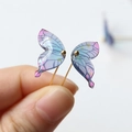 Macro shot of gradient resin butterfly earring with realistic veins and gold bead - Purple Butterfly