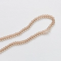 Gros plan de perles en cristal facetté champagne 3,5 mm pour la fabrication de bijoux DIY - Café