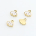Detailed view of four gold-plated smiling cloud pendants with white enamel finish - 4# White Cloud