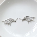 Detailed view of devil wing jewelry accessories with pavé cubic zirconia and silver finish - White Gold
