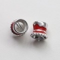 Macro view of red enamel and gold-plated witch hat beads for DIY jewelry making - White Gold