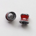 Close-up of red enamel witch hat jewelry charms with silver-tone trim for DIY crafts - Gunmetal