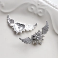 Detailed view of silver heart earrings with angel wings and micro-paved cubic zirconia - Silver (5#)