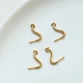 Detail of four gold-plated S-shaped jewelry connectors with arrows and screw threads - Gold Tail (1#)