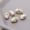 Detail of five handmade white glass oval beads with pink rose flowers and gold foil - Light Pink