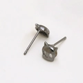 Detailed close-up of gunmetal cat skull stud earrings with polished metallic finish - Black Mask Style
