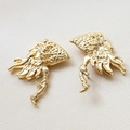Macro shot of gold-plated dragon wing charms with zircon stones on white leather - 1# Dragon Axe / Gold