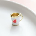 Detail of a mini white enamel heart cup charm with gold handle for DIY jewelry making - White Cup