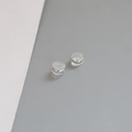 Macro shot of silver-plated copper ear nuts with clear anti-slip silicone pads - 4# White Gold Plated