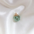 Spherical glass pendant with light blue dried flowers and golden metal loop - Light Green