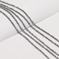 Detailed macro view of 2-3mm faceted grey metallic beads for DIY jewelry making - Silver