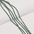 Macro shot of deep green faceted crystal beads for DIY jewelry and necklace making - Iridescent Green
