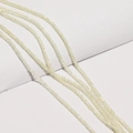 Close-up of faceted light yellow crystal wheel beads for DIY jewelry making and necklaces - Beige