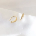 Close-up of 18k gold plated earring hooks with sparkling zircon stones on silk - Marquise Five Stones Style (4#)