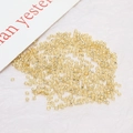 Macro view of 2mm champagne gold silver-lined glass seed beads for DIY jewelry making - 2 mm / Light Gold (7#)