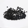Macro shot of high-quality 2mm shiny black ceramic seed beads for DIY jewelry making - 10 g / Black