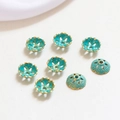 Macro shot of turquoise enamel flower bead caps with gold edges for jewelry making - Style 3 (D1284)