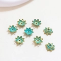 Macro detail of eight turquoise blue flower bead caps with gold edges for DIY jewelry - Style 6 (D1284)