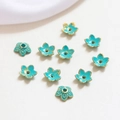 Detail of turquoise flower bead spacers with gold edges for DIY jewelry making - Style 7 (D1284)