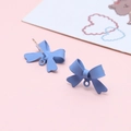 Detail of matte blue bow earring connectors with 925 silver pins and hanging loops - Light Blue Bowknot Earring Stud