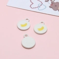 Detail of round white enamel charms with yellow banana pattern for DIY jewelry making - Banana Round Plate
