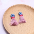 Handgefertigte bunte Baumwollquasten in Blau, Rot und Pink für DIY-Schmuck - Lotusrosa