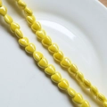 Detail showing bright yellow heart ceramic beads with glossy finish for DIY jewelry - 12# Yellow