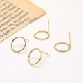 Detailed view of 18k gold plated twisted hoop earrings with fine braided metal texture - 18K Gold Plated Textured Hollow Round Stud Earring