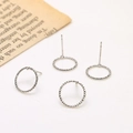 Detail of four silver hoop earrings with twisted rope texture on vintage paper - White Gold Plated Textured Hollow Round Studs