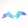 Close-up of translucent glitter resin mermaid tail charms with purple blue gradient effect - 6# Mermaid Tail