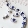 Macro view of blue and white porcelain windmill clog beads for DIY jewelry making - Dutch Wooden Shoe Shaped Bead (6#)