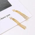 Macro view of gold-plated clover knot pendant with delicate metal chain tassels for DIY - Clover Knot Style / Gold