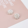Macro view of white seed bead cluster earrings with polished light gold metal base - White