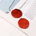 Close-up of irregular resin earring charms with smoky marble texture and wavy edges - Irregular Round (Style 1) / Red