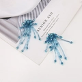 Detailed view of handmade dark blue crystal beaded tassel earrings with layered fringes - Blue