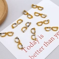 Detailed macro of tortoise shell acetate mini eyeglass pendants for DIY jewelry making - Ginger Yellow Glasses Style