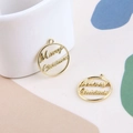 Detail of round golden Merry Christmas alloy charms with festive hollow-out design - Gold Merry Christmas