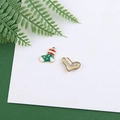 Detail view of festive red and green enamel Christmas stocking charm with gold backing - Christmas Sock