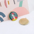 Detail of alloy enamel charms showing abstract female portrait and brushed gold texture - Blue Round Lady Portrait Style With Red Hat