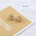 Detailed view of 10x13mm hollow golden sphere pendants with inner white beads - 23# Hollow Mesh Ball Shape