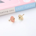Close-up of mini pink enamel umbrella pendants for DIY jewelry making and earring crafts - Pink Umbrella