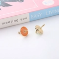 Detail view of mini umbrella charms with orange enamel and golden metal alloy finish - Orange Umbrella