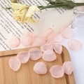 Macro detail of peach mesh flower petals used for DIY romantic fairy jewelry and hair accessories - Orange Pink