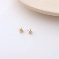 Macro shot of 18K gold plated four-petal flower earring studs with small hanging loops - 8# K Gold Flower Caps