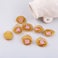 Detail of pink and gold mesh fabric flower petals for DIY jewelry and hair accessories - Turmeric